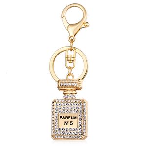 Moda criativa diamante pingente automático chaveiro garrafa de perfume chaveiro feminino pingente acessórios 248c