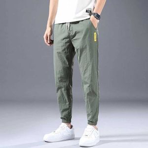 Ice Silk Pants Men's Summer Thin Section Trend Wild Loose Casual Sports Quick-drying Harlan Nine-point 5XL Y0811