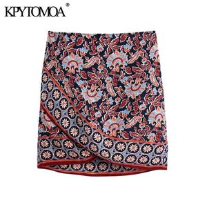 KPytomoa Mulheres Chic Moda Totem Impressão Assimetria Envoltório Mini Saia Vintage Cintura Alta Cintura Curva Amarrado Feminino Saias Mujer 210724