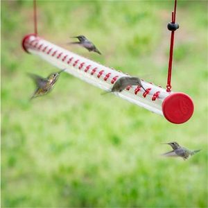 Inne ptaki dostarcza podajnik na dziedziniec z jaskrawoczerwoną przezroczystą tubą Łatwo do czyszczenia na świeżym powietrzu, oglądanie akcesoriów