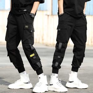 Streetwear Preto Harem Calças Homens Elástico Cintura Punk Calças com fitas Casuais Calças Slim Basculadoras Homens Hip Hop Calças X0723