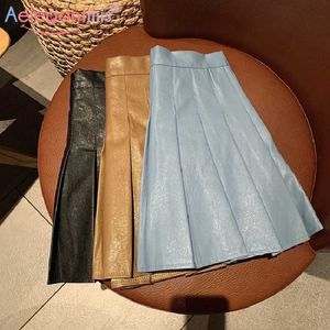 Aelegantmis högkvalitativa kvinnor solid pu mini pläterad kjol koreansk mode vintage kvinnlig smal söt läder hajuku chic 210607