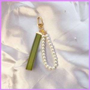Pearl Kadınlar Moda Anahtarlık Kabuk Conch Anahtar Zincirleri Tasarımcı Erkek Anahtar Charm Açık Çanta Araba Zinciri Kalp Tasarımcıları Ile D219254F