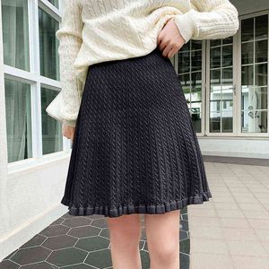 Autumn and winter new knitted skirt slim chic twist wood ear edge a word solid color short skirt for women