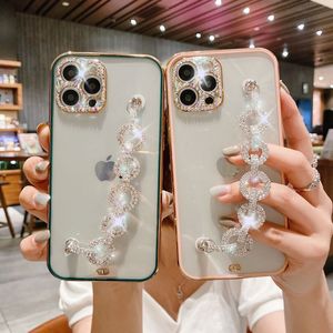 Estojos de proteção de câmera de diamante de luxo bling alça de mão com glitter corrente de pulso mulher meninas chapeamento macio TPU fino capa protetora para iPhone 13 12 11 Pro MAX 8 7 Plus SE2