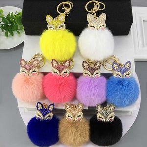 Nya pärlor Rhinestones Animal Head Hair Ball Key Ring Pendant Kvinnors Väska Tillbehör Hemleverans G1019