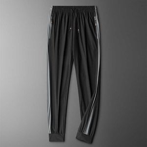 Pants Men 2021 New Summer Ice Silk Breathable Casual Pants Mens Air-conditioned Pants Stitching Trousers Quick-drying Streetwear Y0811
