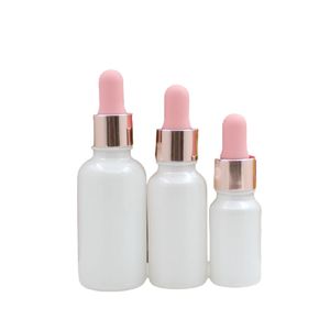 Garrafa de embalagem cosmética 5ml 10ml 20ml 30ml 50ml pérola vazia lotador de vidro branco recipiente recipiente Refil Top Brilhante Rosa LID de ouro frascos de óleo essencial