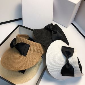 女性のためのソリッドカラービンテージ麦わら帽子夏の屋外カジュアルキャップサンビーチちょう結び帽ファッション中空調節可能なバイザー帽子