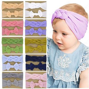 2 pz/set tinta unita annodato a croce neonate fascia elastica moda bowknot fatto a mano fascia per capelli in nylon per bambini accessori per bambini