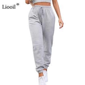 Liooil sexig hög midja lösa fleece sweatpants byxor med fickfösten vinter svart vit baggig joggare kvinnor svett byxor 210915