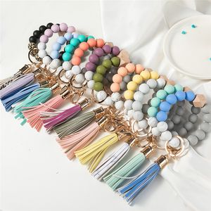 14 Colors Wooden Tassel Bead String Bracelet Keychain Food Grade Silicone Beads Bracelets Women Girl Key Ring Wrist Strap Bracelet KeyChains Car Beaded Wristlet