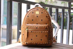 High-quality Backpack fashion Korean version of M punk inlaid gold copper nail luggage male and female student schoolbag