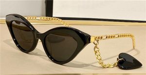 Fashion Design Woman Sunglasses S Cat Eye Frame Populaire en veelzijdige stijl Topkwaliteit Outdoor UV400 Beschermende brillen met hartvormige glazen ketting