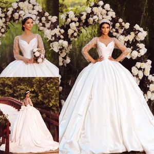 Princess Ball Gown Wedding Dresses Sheer Bateau Neck Sequined Bridal Gowns With Long Sleeves Appliqued Sweep Train Satin Vestido De Novia