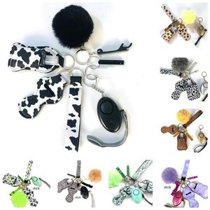 30 färger 9 st/sets Defense KeyChain Set Alarm Pompom Hand Sanitizer Wrist Strap Lipstick Nyckelringar Bottle Opener for Woman Men Självförsvar Keyring