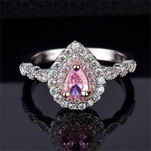Pink crystal pear shaped ring with eight hearts and eight arrows X0715