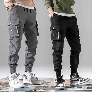 3xl xxxl multi-pocket elastisk midja design harem byxa män streetwear punk hip hop casual byxor joggare man dans pant y0927