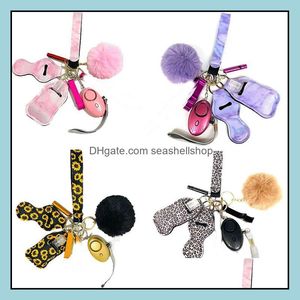 23 Färger 8st Defense KeyChain Set Alarm Pompom Keychains Hand Sanitizer Wrist Strap Lipstick Bottle Opender Whistle for Woman Men Self-Defe