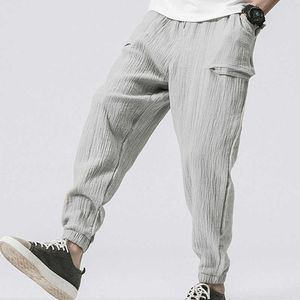 Bawełniane spodnie haremowe z kieszeniami Męskie wiosna lato moda streetwear casual sznurek elastyczne talii smaczne spodnie x0723