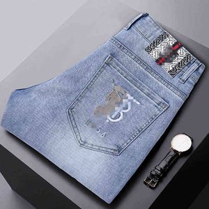 Sommaren 2021 Tunna jeans för män i koreansk version Small Foot Slim Fit Cotton Elastic International Brodery