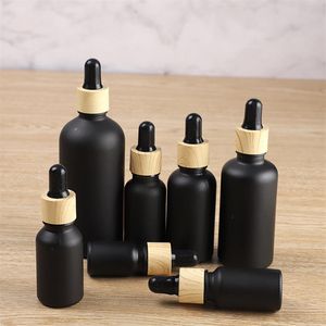 Essential Oil Bottle Matte Black Glass e liquid Essential Oil Perfume Bottles with Reagent Pipette Dropper and Wood Grain Cap DHL