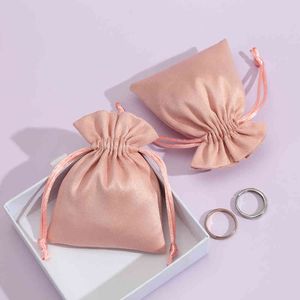 50pcs sammet dragsko chic liten presentförpackning väska örhängen ring halsband smycken förpackning display flannel rosa påsar