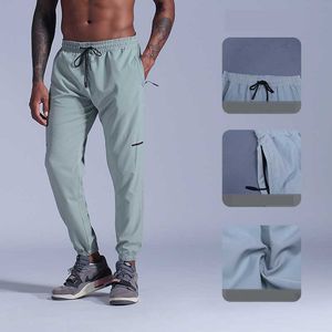 Mens Tracksuit Pure Färg Sportbyxor Mens Training Beam Foot Quick-Torka Casual Byxor Sommar Tunn Andas Running Fitness Joggers