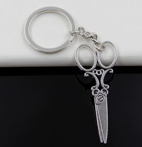 Fashion 20pcs / Lot Key Ring Keychain Smycken Silverpläterad Sy Saxar Charms