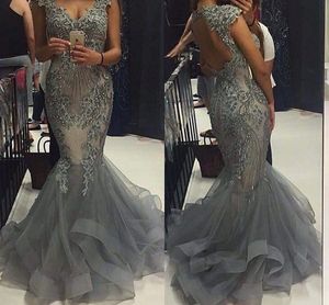 Silver Evening Dresses 2016 With Cap Sleeves V Neck Sequins Beading Prom Dress Mermaid Ruffles Hollow Back Pageant Quinceanera Gowns
