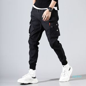 Люкс-хип-хоп Мужчины Pantalones Hombre High Street KPOP Случайные грузовые брюки со многими карманами Joggers Modis Streetwear брюки Harajuku