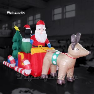 Personagem de Natal personalizado Papai Noel inflável entregando presentes em um trenó puxado por renas para a decoração da véspera do Natal