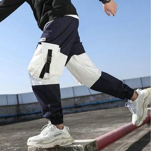 Hip Hop Boy Garoto Multi-bolso elástico Design harém de harem Pant masculino punk calças casuais jogador machos calças masculinas da moda