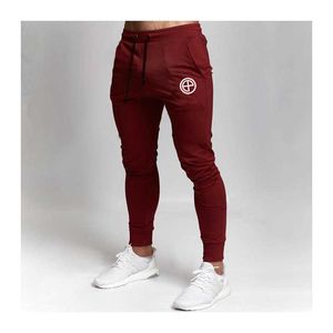 Mens Tracksuit Bottoms joggers sportbyxor Gymmar tunn fitness mager byxor elasticitet som kör byxor män solid casual pantalon p0811