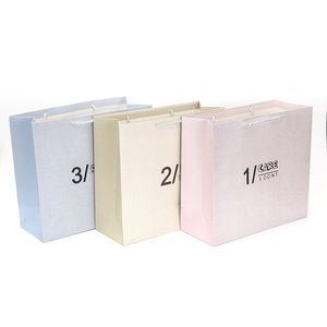 Customized 250GSM Roupa de papel revestido sacos de embalagem de compras com fita Saco de embalagem de presente eco-friendly