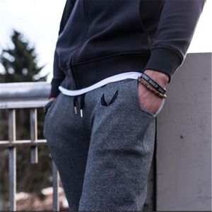 Pantalones para hombres hombres casuales de aluminio de moda sudor macho pantalones negros de alta calidad para m-xxl