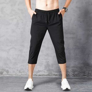 Letnie spodnie Długość łydki Mężczyźni Ice Silk Mens Causal Ołówek Spodnie Spodnie Elastyczne Moda Joggers Mężczyźni Streetwear Odzież 5XL 210601