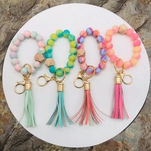 Handmade stretched spring rainbow silicone beads bangle keychains pu leather tassel wristlet bracelet keyrings for 2022