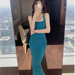 Hepburn style knitted French retro sling dress female spring and autumn tea break design sense niche mid-length skirt 210520