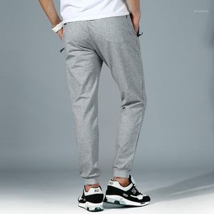 Męskie bawełniane spodnie dresowe Solid Casual Skinny Sznurek Elastyczne Mid Spodnie Wygodne Kostki Ołówek Spodnie na Wiosna Jesień 4XL