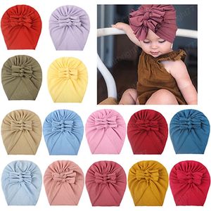 Сплошной цвет ручной работы бабочки младенческие эластичные шляпы удобные теплые детские девочки шапки мода луки головные одежды подарки на день рождения