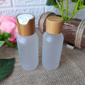 Garrafa de recipiente cosmética de plástico transversal fosco com tampa de madeira de bambu Cuidados de pele Embalagem de creme frasco de perfume