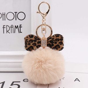 8cm Leopardtryck Pompom Keychain Fluffy Faux Kanin Fur Ball Kvinnor Handväska Hängsmycken Bil Key Ring Crystal Bow Key Chains Smycken G1019