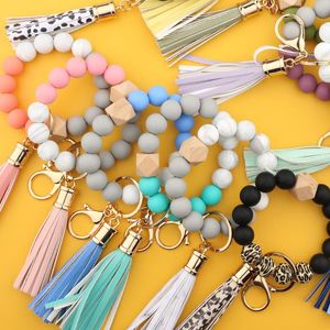 Festas de festas Moda Bead de Silicone Braceletes Beech borla Chaveiro Chaveiro Pingente de Couro Pulseira Jóias Mulheres 14 Estilo