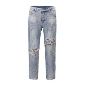 Jeans da uomo Jeans usati con barba di gatto con foro sottile di marca di moda di alta moda