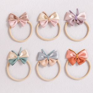 Nya Satin Ribbon Bows Nylon Baby Butterfly Bow Headband Hairpins Kids Girls Nylon Elastic Hairbands Hårtillbehör