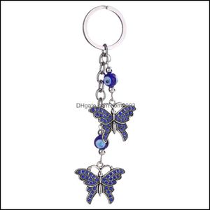 Yüzük mücevherler kötü göz takılar anahtarlık kelebek kaplumbağa kulesi sarkık püskül kristal araba anahtar zinciri kadın moda mücevher hediyeleri Del