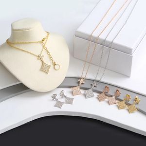 Europa Amerika Mode-Stil Schmuck-Sets Dame Frauen Gold/Silber/Rose-Farbe aushöhlen V-Initialen Einstellung voller Diamant-Blumen-Charme-Halsketten-Ohrringe