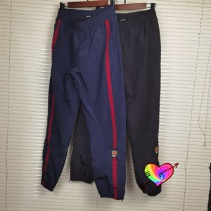 Casual Hip Hop Men Women Embroidery Pants Side Stripe Logo Trouser Lining Mesh Zipper Leg