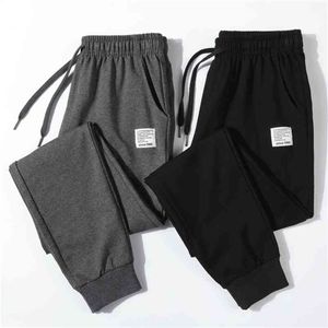 Spodnie fitness Mężczyźni bawełniane spodnie dresowe moda pełna długość spodnie sznurkowe do casual 4XL 210715
